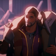 T'Challa carrying an unconscious Korath on his shoulders.